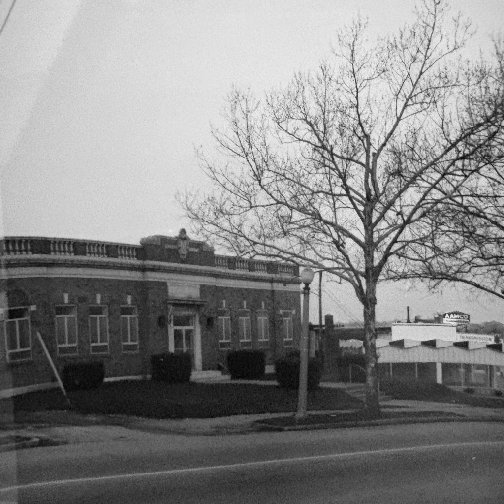 Three-quarter view of the Craftsmen Lodge building on Bates Street with surrounding neighborhood